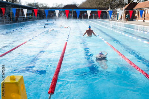 Swimmers compete in the London Fields aquathlon