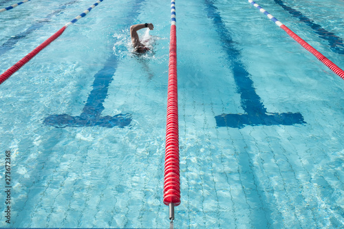 A swimmer talking an early morning open air swim