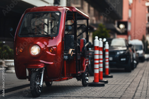 electric rickshaw parked near hotel