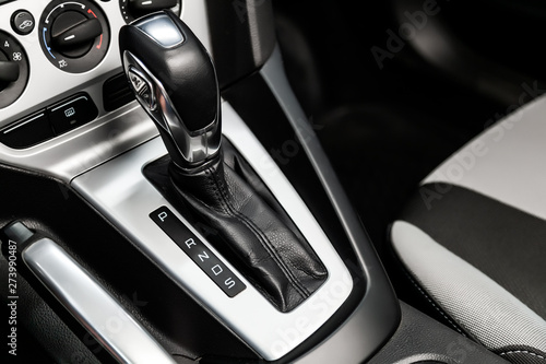 Close-up of the accelerator handle with silver metallic. automatic transmission gear of car , car interior