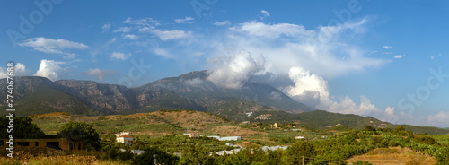Dim River National Park mountain range in the clouds. Panoramic landscape of mountains with cloudscape.