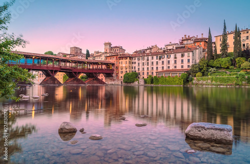 Bassano del Grappa during the sunset with city reflections on Brenta River