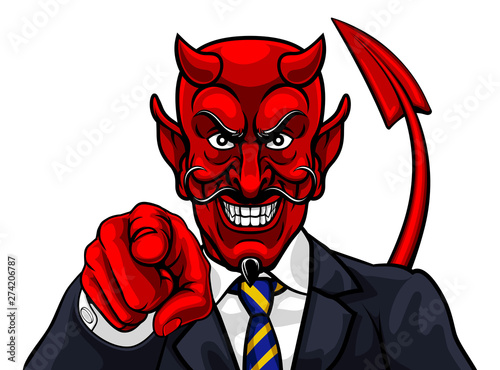 An evil devil or Satan businessman in business suit pointing at the viewer