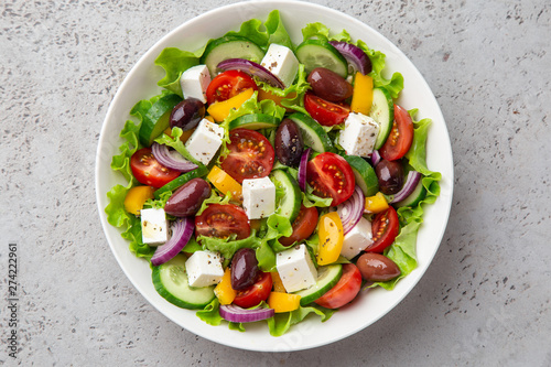 fresh greek salad ( tomato, cucumber, bel pepper, olives and feta cheese) in white bow