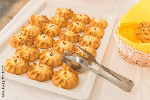 Cretan Sweet Cheese Pastries (Kalitsounia) on the table of the hotel restaurant, as a gift for guests in honor of the Easter holiday