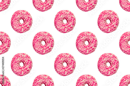 pink frosted donuts with white sprinkles on white background. Seamless pattern