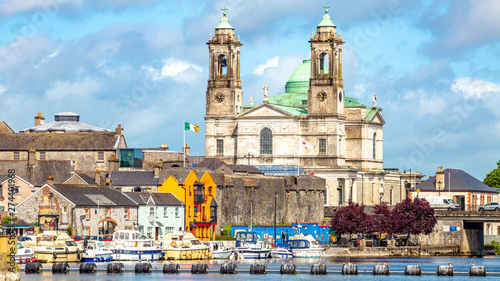 Beautiful view of the parish church of Ss. Peter and Paul and the castle in the town of Athlone next to the river Shannon, wonderful cloudy day in the county of Westmeath, Ireland