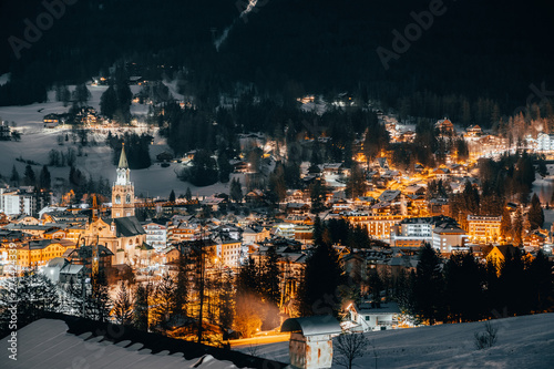 Scenic night view over Cortina d'Ampezzo in winter. Cortina d'Ampezzo is located in Dolomites, Italy.