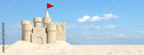 Sandcastle on the beach with sand in summer