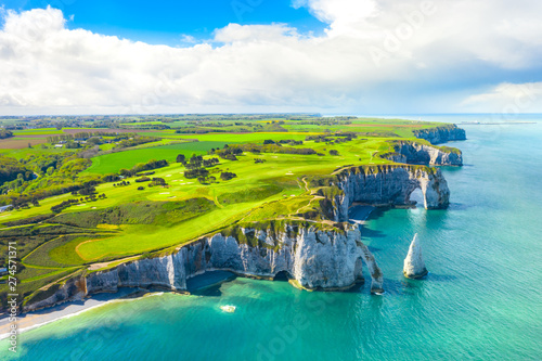 Picturesque panoramic landscape on the cliffs of Etretat. Natural amazing cliffs. Etretat, Normandy, France, La Manche or English Channel. Coast of the Pays de Caux area in sunny summer day. France