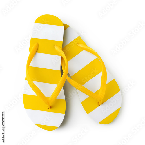 Top view of summer beach yellow striped flip flop isolated on white background sea holiday vacation and travel concept