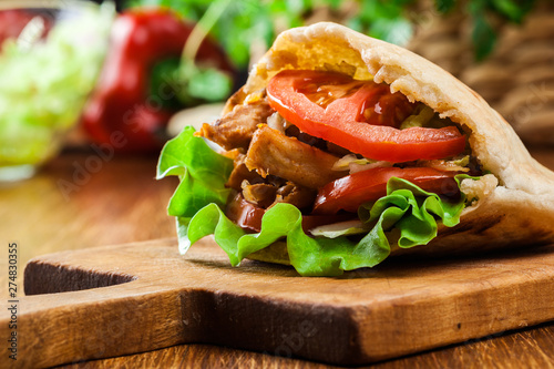 Doner kebab - fried chicken meat with vegetables