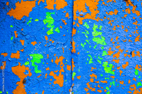 Old corroded metal wall background with flaky blue paint .Rusty flaky cracked metal surface.Abstract the surface texture of the old metal.