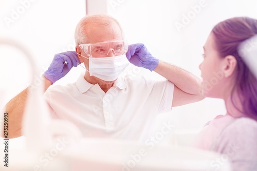 Medical personel (doctors, nurses and dentists) during different procedures with patients.
