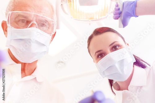 Medical personel (doctors, nurses and dentists) during different procedures with patients.