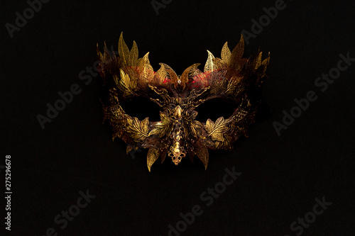 Cosplay, Venetian mask in gold and red with metallic pieces in the form of leaves. original and unique design, handmade crafts