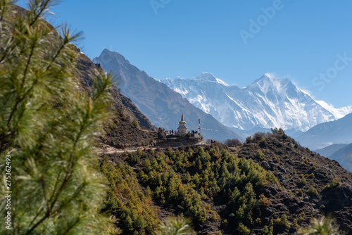 Tourists and stupe with Everest and Lhotse