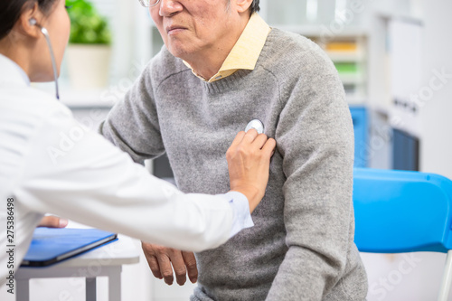 Female doctor do heartbeat check