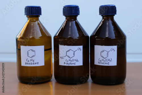 Organic solvents in dark glass bottles: benzene, p-xylene, toluene.