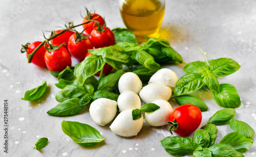  Italian caprese salad ingredients: mozzarella, tomatoes, organic basil and olive oil. recipes italian cuisine