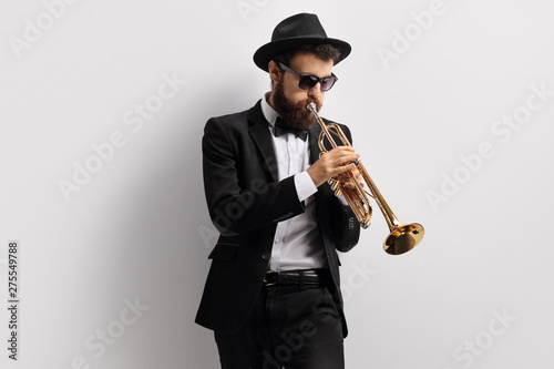 Bearded guy playing a trumpet