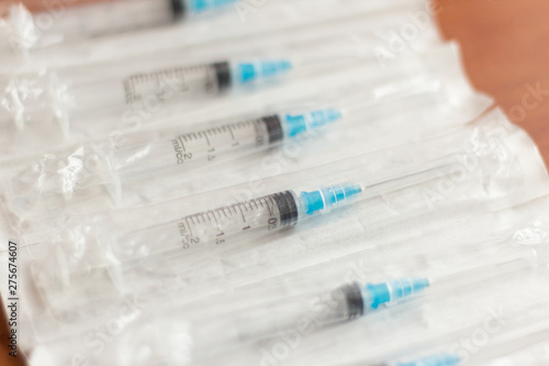 new disposable injection syringes in the package, close-up, selective focus