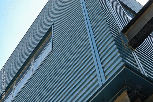 Blue metal exterior siding of a building.