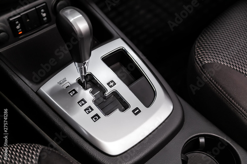 Close up of the automatic gearbox lever, blackinterior car; Automatic transmission gearshift stick;