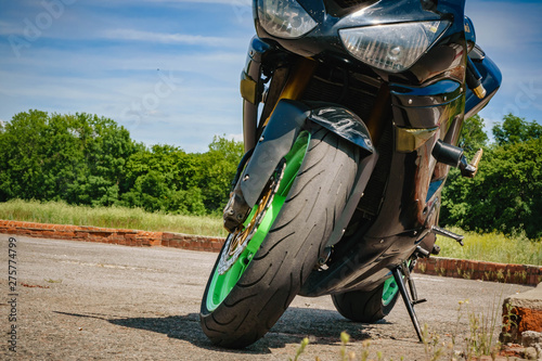 sport bike black with green rims front view