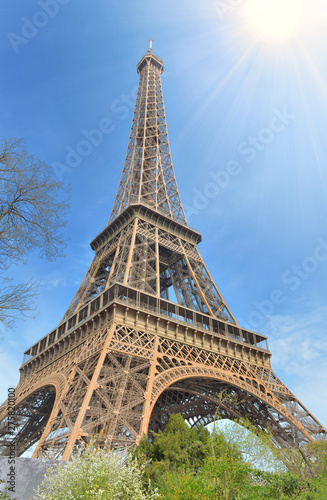 eiffel tower in Paris under sunny blue sky