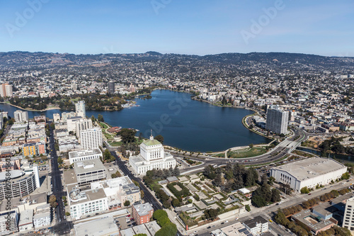 Aerial view of Lake Merritt Park and downtown buildings and streets in Oakland California.