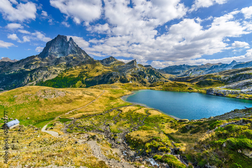 View at Midi Ossau mountain peak and Lake Roumassot, in Ayous-Bious valley in French Atlantic Pyrenees, as seen in October. Aquitaine, France.