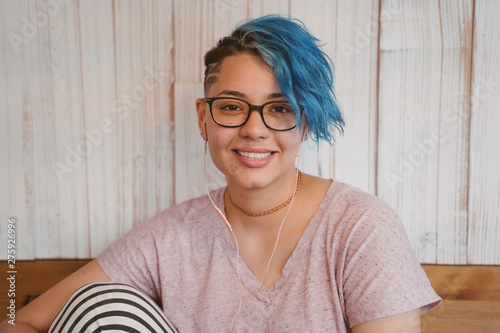 Stylish blue short hair with a lesbian cut.