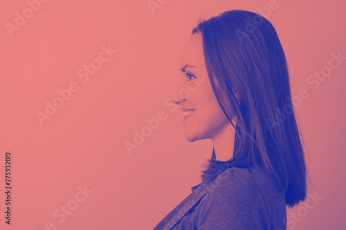 Duotone portrait of a woman in profile with space for text