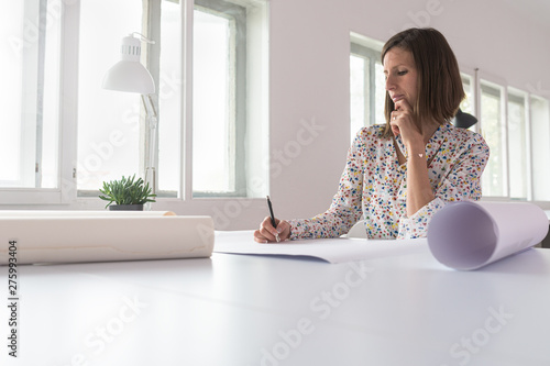 Young woman working in her office