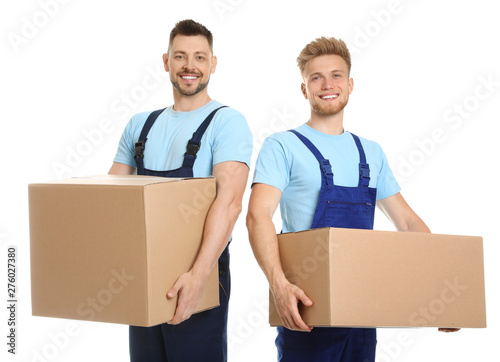 Portrait of moving service employees with cardboard boxes on white background