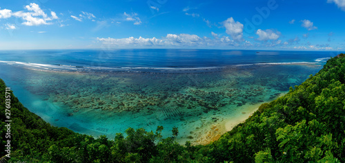 view of the coast with beach and coral at bukit in bali -indonesia