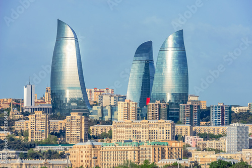 05/05/2019 Baku, Azerbaijan, Panoramic view of Baku city and image of Flame Towers in the middle of old buildings near the Caspian Sea coast