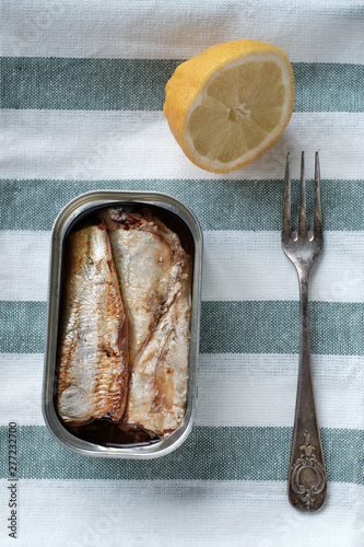 can of sardines on kitchen towel