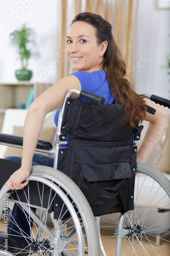 woman in a wheelchair at home