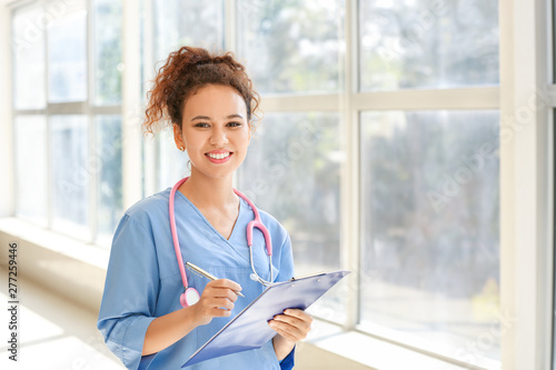 Young African-American nurse in clinic