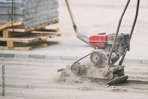 Plate compactor for for soil compaction pavement or sidewalk in the city.