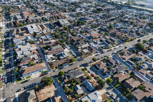 Afternoon aerial view of residential streets and buildings in the south bay area of Los Angeles County, California. 