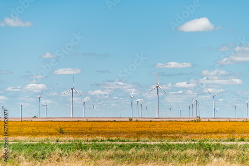 Wind turbine farm generator near Roscoe or Sweetwater Texas in USA in prairie with rows of many machines for energy