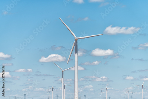 Wind turbine farm closeup near Snyder Roscoe and Sweetwater Texas in USA isolated against sky