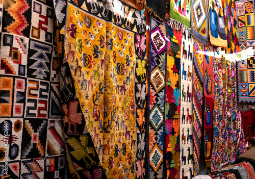 Colorful Peruvian artisanal textiles cloth with inca and traditional patterns at street Andean market in Pisac, sacred valley, Peru.
