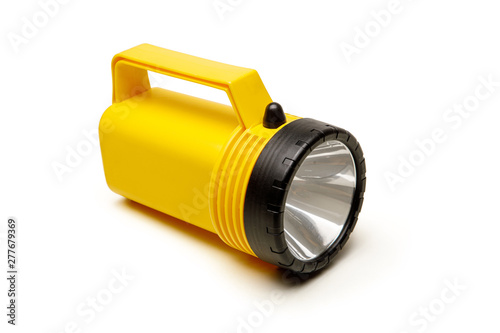 Yellow flashlight isolated on the white background.