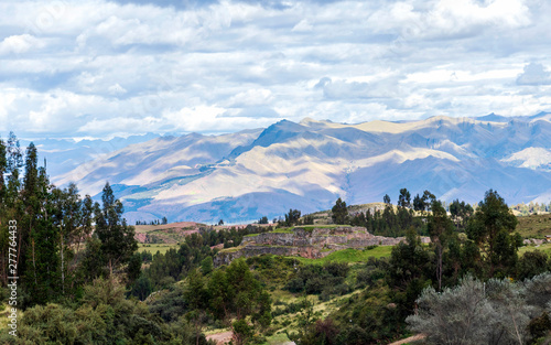 Green mountain landscape with Inca ruins of fortress Puka Pukara, Cusco Region, Peru