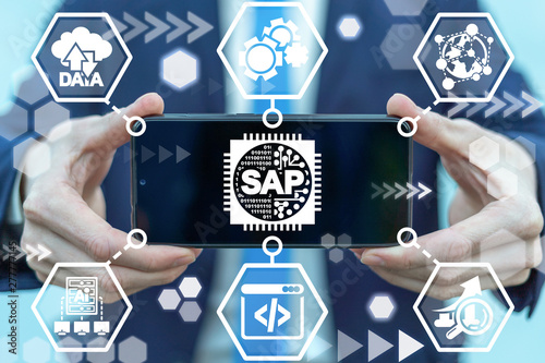 Man holding smartphone with sap micro chip icon on screen. SAP - Business process automation software. ERP enterprise resources planning system concept.