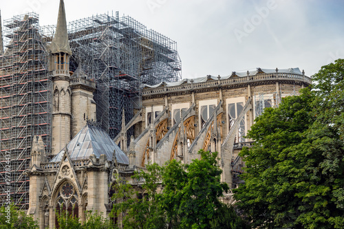 Paris, France - July 10, 2019: Notre Dame de Paris. Reinforcement work in progress after the fire. Wood Shoring now prevent the flying buttresses from collapsing.s after the fire